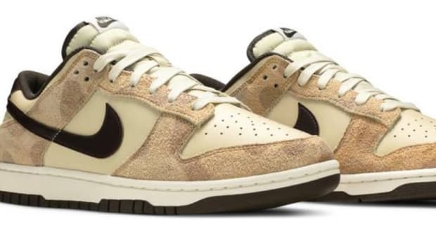 View of tan Nike Dunk shoes.